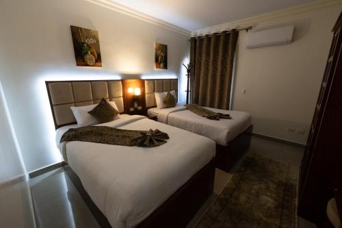 Ένα ή περισσότερα κρεβάτια σε δωμάτιο στο Gleem Luxury Apartments Elite