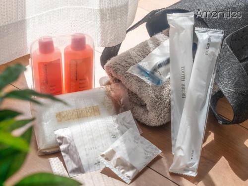 a table topped with a pile of products on a table at WeeklyHouse Biwako Otsu - Vacation STAY 19732v in Otsu