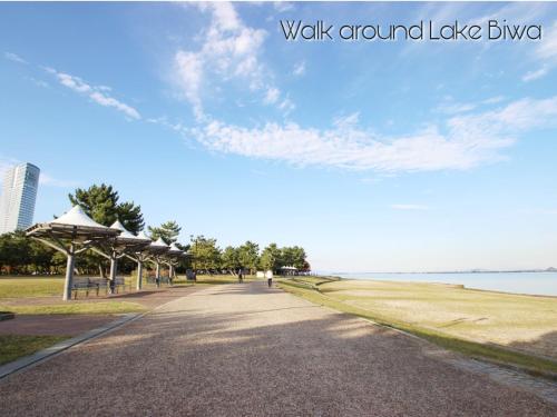 a walkway near the water in a park at WeeklyHouse Biwako Otsu - Vacation STAY 19732v in Otsu