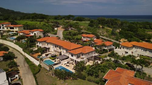 an aerial view of a house with a swimming pool at Luxury Villa In Prestigious Pristine Bay, Home Of The Black Pearl Golf Course in French Harbour