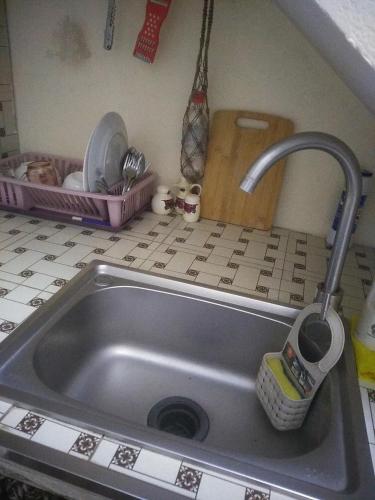 a sink in a kitchen with a sink at Двухуровневая квартира студия - Duplex studio apartment in Dushanbe