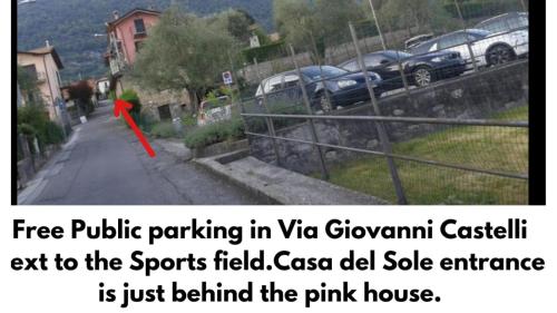 a picture of a parking lot with a red arrow at casa del sole Ossuccio in Como