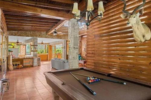 a pool table in a room with a wall at 3 bed 2 bath W pool @ Juncos in Canovanas