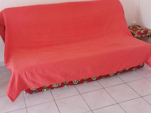 Ένα ή περισσότερα κρεβάτια σε δωμάτιο στο les flamboyants