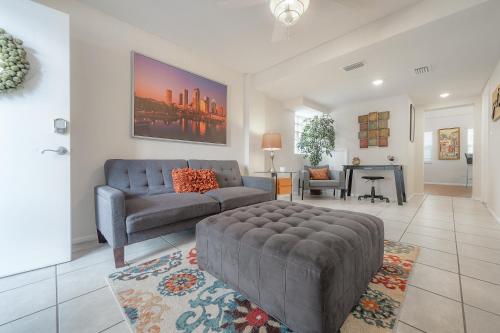 a living room with a couch and a table at Seminole Heights - Foodie Capital of Tampa in Tampa