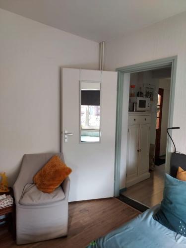a living room with a couch and a window at Os Heem in Wittem