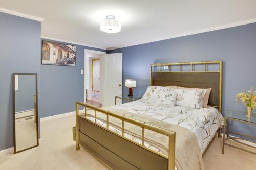 een slaapkamer met een groot bed met blauwe muren bij Waterville Home Rental with Private Yard and Deck! in Waterville