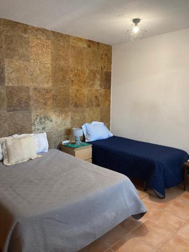 En eller flere senge i et værelse på Casa Praia do Sul
