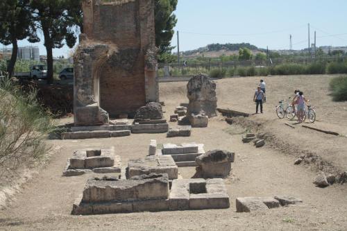 a group of people riding bikes in an ancient ruins at Hotel d'Altavilla in Canosa di Puglia