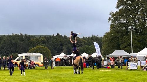 a man is on top of a horse at a show at Carnmhor, Isle of Skye - Stunning 242 year old cottage on its own sea shore! in Breakish