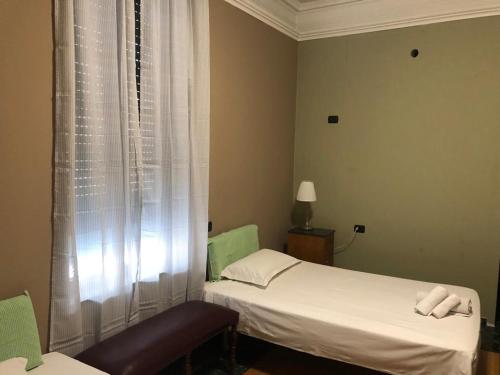 a hospital room with two beds and a window at Villa Camilla Milano in Milan