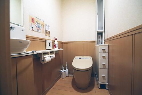 a small bathroom with a toilet and a sink at TOKYO HOUSE INN - Vacation STAY 02084v in Tokyo
