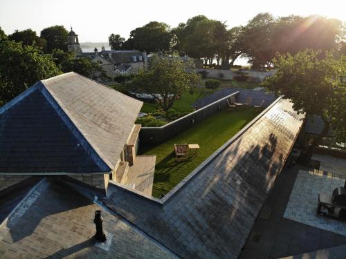 an overhead view of a house with a roof at Normanton Park House - Luxury Rutland Water Home in Oakham