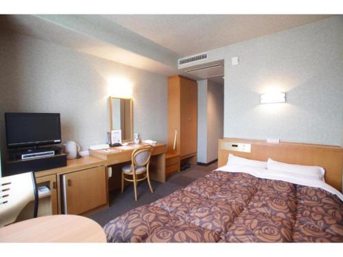 a hotel room with a bed and a desk at Hotel Socia - Vacation STAY 53776v in Hita