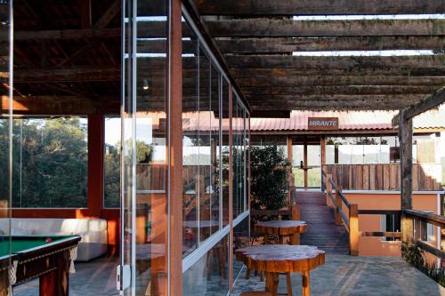 a patio with tables and a pool table at Chácara Caminho das Águas in Piraquara