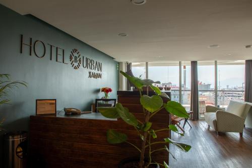 a hotel room with a plant in a room at Hotel B Urban Xaman by Fontán Reforma in Mexico City