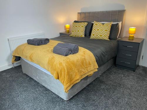 a bedroom with a bed with two pillows on it at Redcar Retreat in Redcar