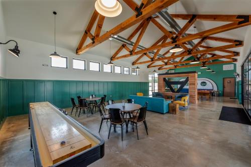 a large room with a ping pong table and chairs at Great Escapes RV Resort Bryan College Station in Bryan