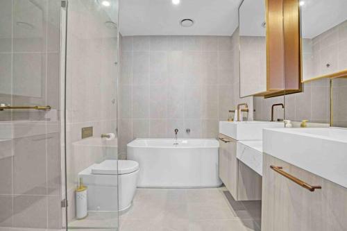 a bathroom with a toilet and a sink and a shower at 3 Bedrooms Apt in Glen Waverley central * parking in Glen Waverley