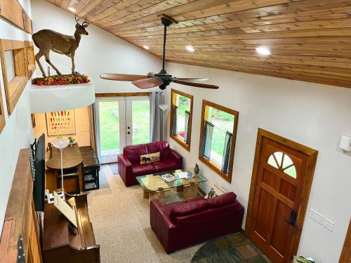 A seating area at 2 Adjacent Cabins near Silverwood - Serene, Private and Forested