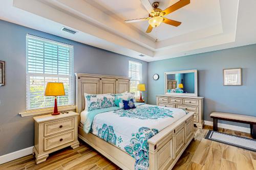 a bedroom with a bed and a ceiling fan at Paradise in Creekside Preserve in Fort Myers