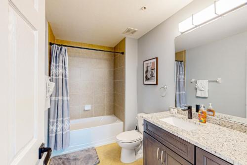 a bathroom with a sink and a toilet and a tub at Paradise in Creekside Preserve in Fort Myers