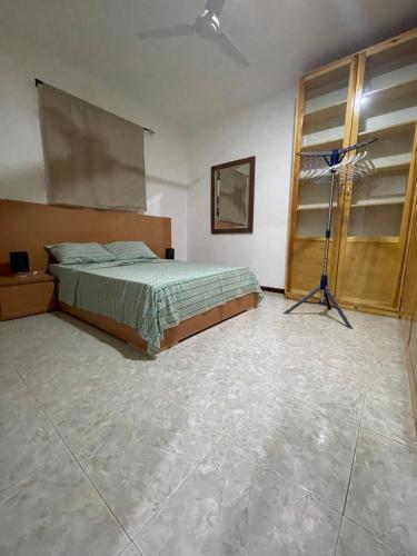 a bedroom with a bed and a basketball hoop at Isa House - Private Rooms in a Shared Duplex in Praia