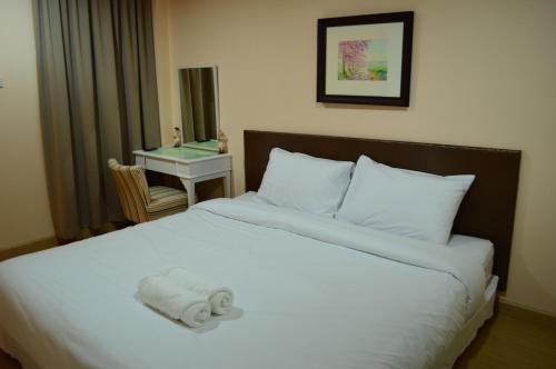 מיטה או מיטות בחדר ב-The Grace House Chiangmai