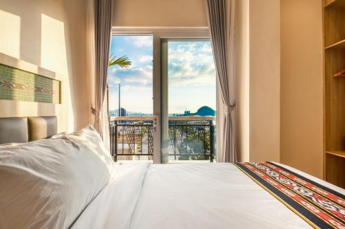 Letto o letti in una camera di DEJAVU 2.0 HOTEL BAJO KOMODO
