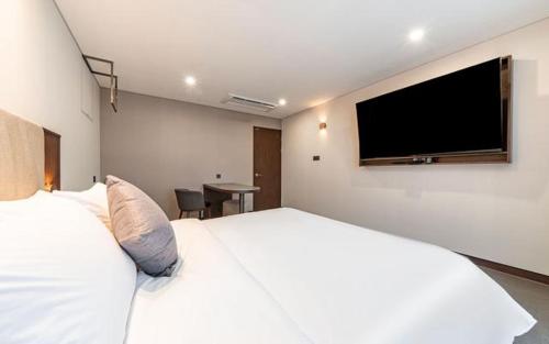 TV a/nebo společenská místnost v ubytování Hound Hotel Gijang Osiria