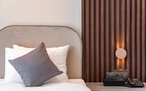 Postel nebo postele na pokoji v ubytování Hound Hotel Gijang Osiria