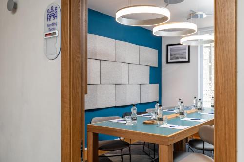 a conference room with a long table and chairs at Holiday Inn Express Aberdeen City Centre by IHG in Aberdeen