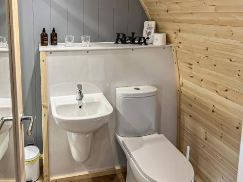 a bathroom with a toilet and a sink at Barrow View - Uk43775 in South Barrow