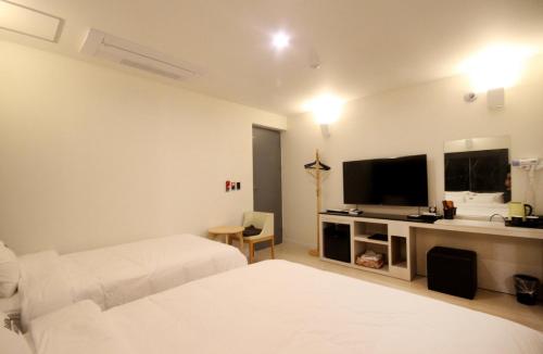 Postel nebo postele na pokoji v ubytování Bandal Hotel