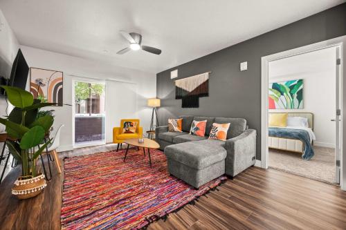 a living room with a couch and a bed at Urban Adventure Awaits Near Everything in Salt Lake City