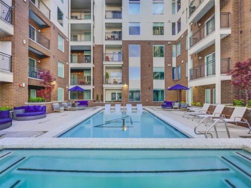 a swimming pool in the courtyard of a apartment building at Urban Adventure Awaits Near Everything in Salt Lake City