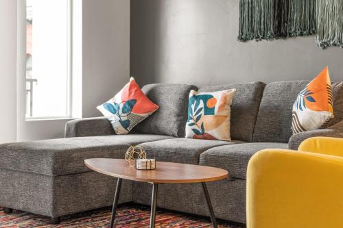 a living room with a couch and a table at Affordable APT in Salt Lake City Ideal Location in Salt Lake City