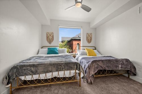 a bedroom with two beds and a window at Affordable APT in Salt Lake City Ideal Location in Salt Lake City