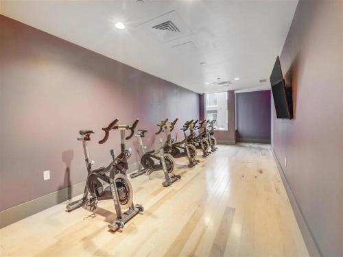 a row of bikes lined up in a gym at Affordable APT in Salt Lake City Ideal Location in Salt Lake City