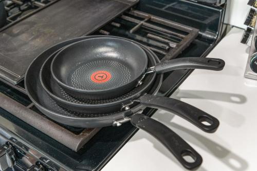 a black frying pan sitting on top of a stove at Affordable APT in Salt Lake City Ideal Location in Salt Lake City