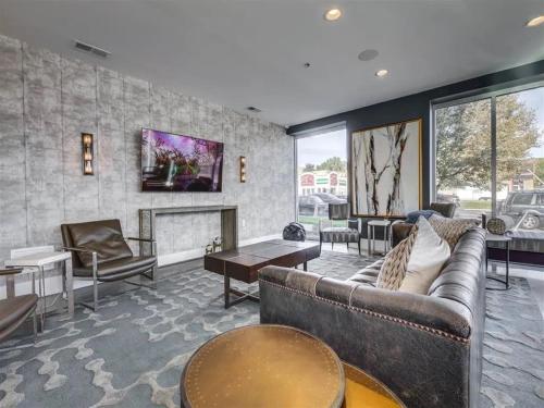 a large living room with couches and a fireplace at Affordable APT in Salt Lake City Ideal Location in Salt Lake City