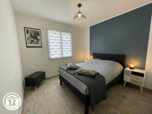 a bedroom with a large bed and a window at Maison neuve en Vendée, 3 chambres, proche véloroute et océan, wifi, terrasses, tout inclus. - FR-1-426-542 in Beauvoir-sur-Mer