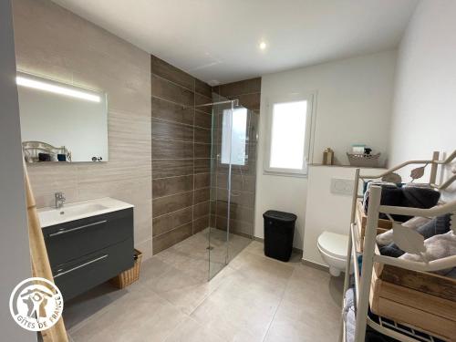 a bathroom with a shower and a sink and a toilet at Maison neuve en Vendée, 3 chambres, proche véloroute et océan, wifi, terrasses, tout inclus. - FR-1-426-542 in Beauvoir-sur-Mer