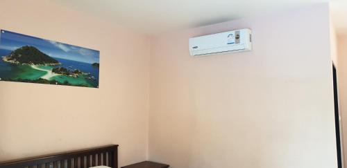 a room with a wall mounted air conditioner on the wall at Moon Travel Phangan in Ban Nua
