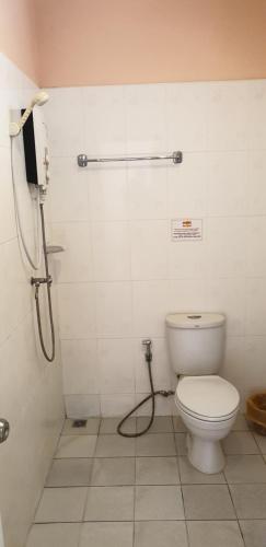 a bathroom with a toilet and a shower at Moon Travel Phangan in Ban Nua