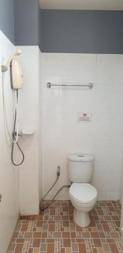 a bathroom with a toilet and a shower at Moon Travel Phangan in Ban Nua