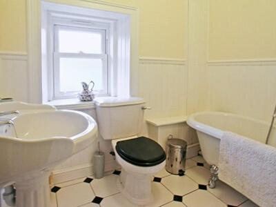 a bathroom with a tub and a toilet and a sink at The Dell in Fort Augustus