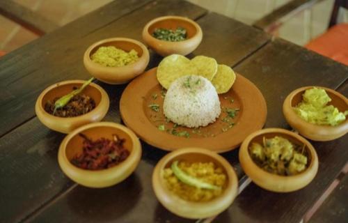 a group of small plates of food on a table at Bundala Flamingo Cotteges in Hambantota