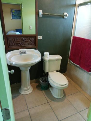 a bathroom with a toilet and a sink at Departamento #8 in San Felipe