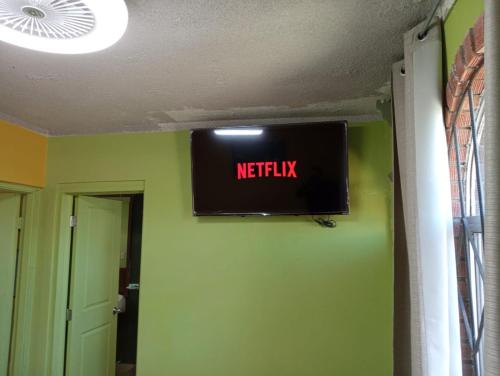 a television hanging on a wall in a room at Departamento #8 in San Felipe